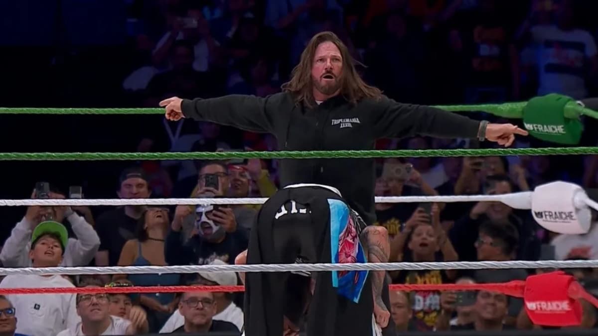 AJ Styles attacking Dominik Mysterio 
