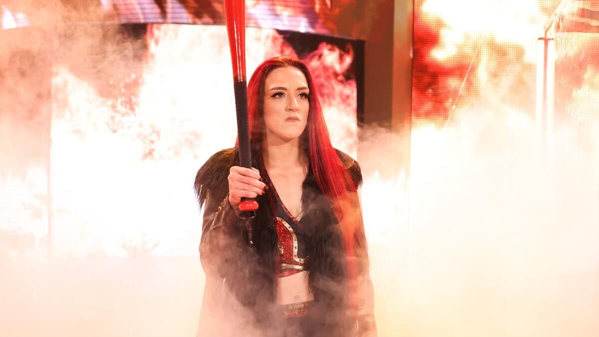 Kay Lee Ray holding a bat