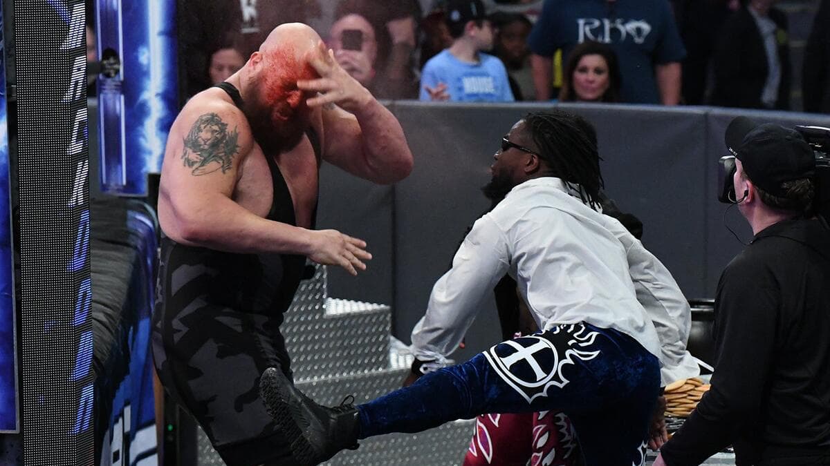 The Big Show covered in red mist with Xavier Woods dressed as Gangrel 