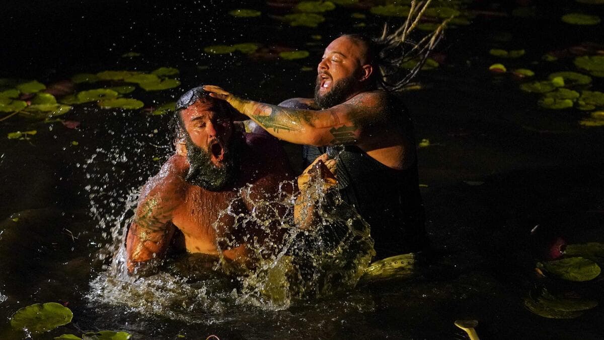 Bray Wyatt drowning Braun Strowman in a swamp at WWE Extreme Rules 2020
