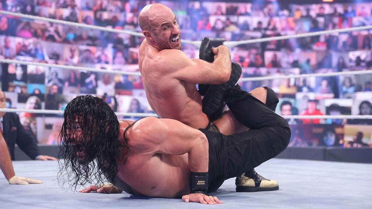 Cesaro with a Sharpshooter on Roman Reigns at WWE WrestleMania Backlash 2021