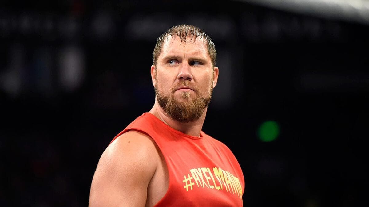 Curtis Axel wearing a red vest
