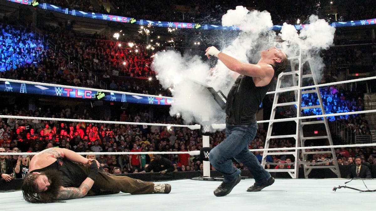 Dean Ambrose falling to the mat surrounded by an explosion at WWE TLC 2014