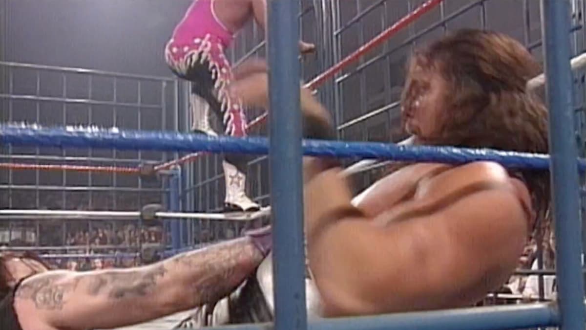 The Undertaker dragging Diesel under the ring at WWF In Your House 6