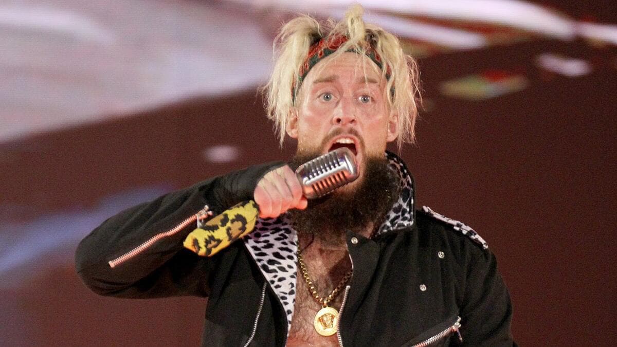 Enzo Amore holding a microphone on WWE Raw