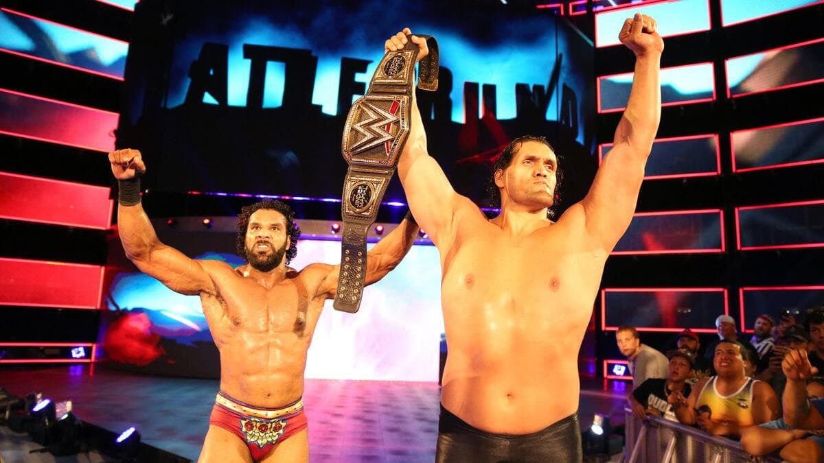 The Great Khali holding up the WWE Title as Jinder Mahal stands next to him at Battleground 2017