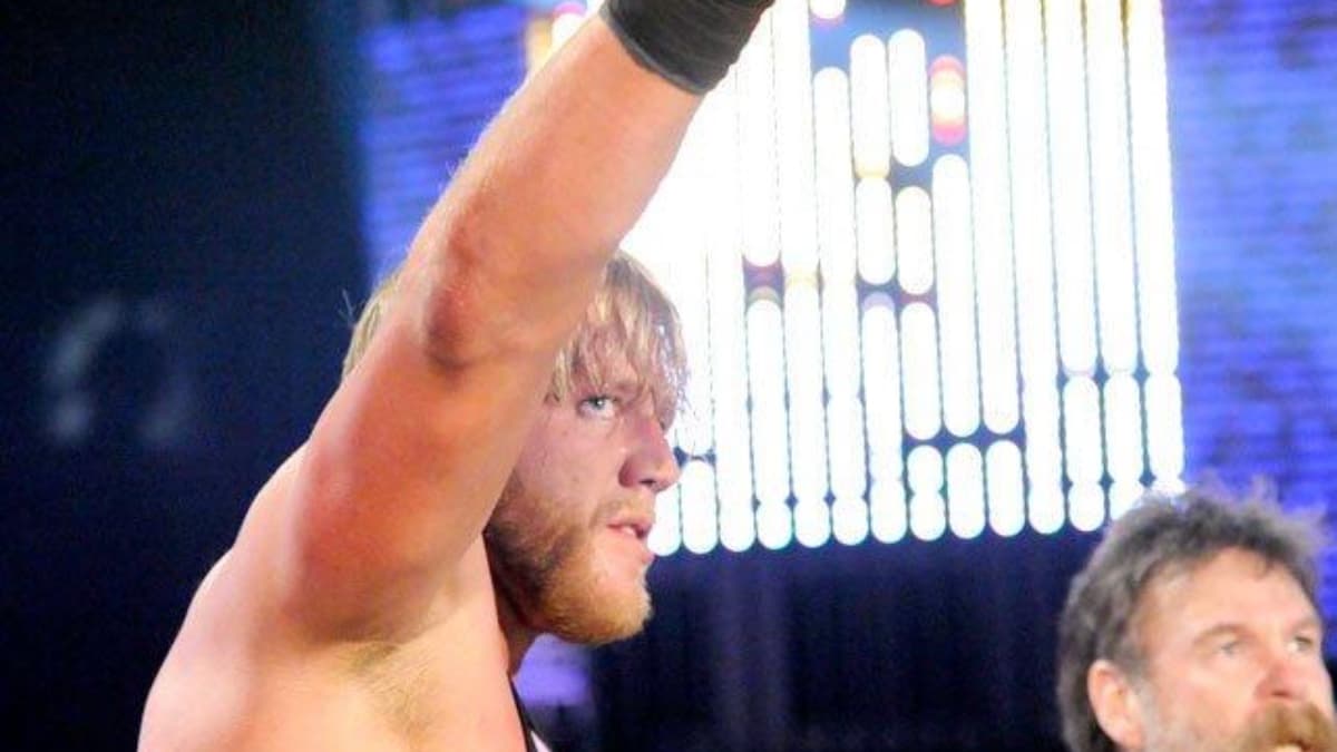 Jack Wagger pointing at the WrestleMania sign