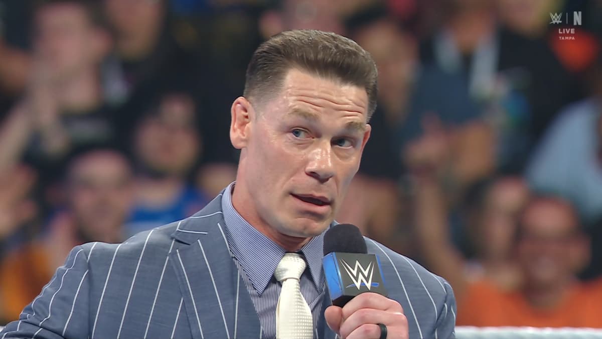 John Cena in a blue striped suit at WWE Backlash 2026