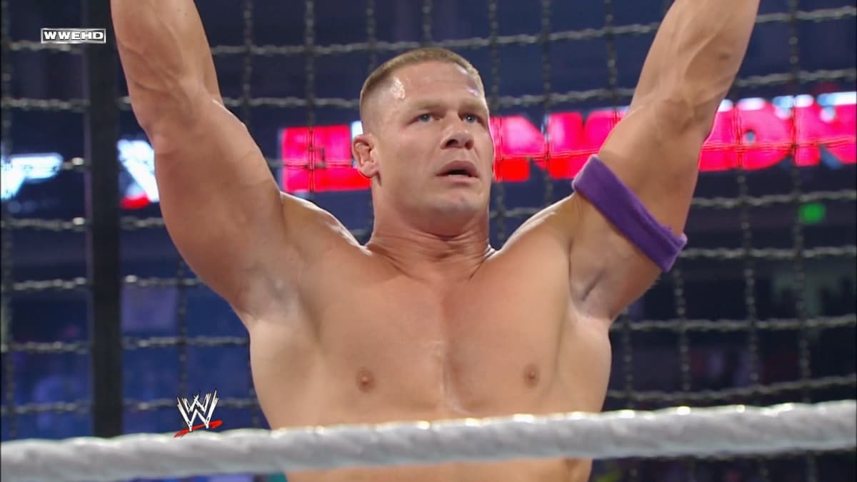 John Cena with his arms raised in his trademark pose at WWE Elimination Chamber 2011