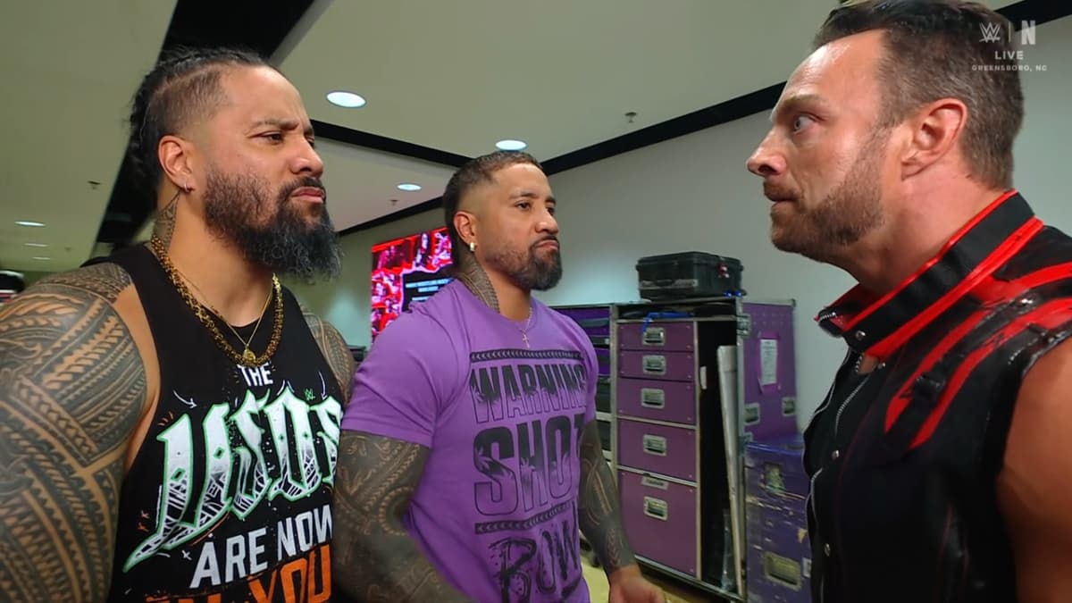 LA Knight in a confrontation with The Usos