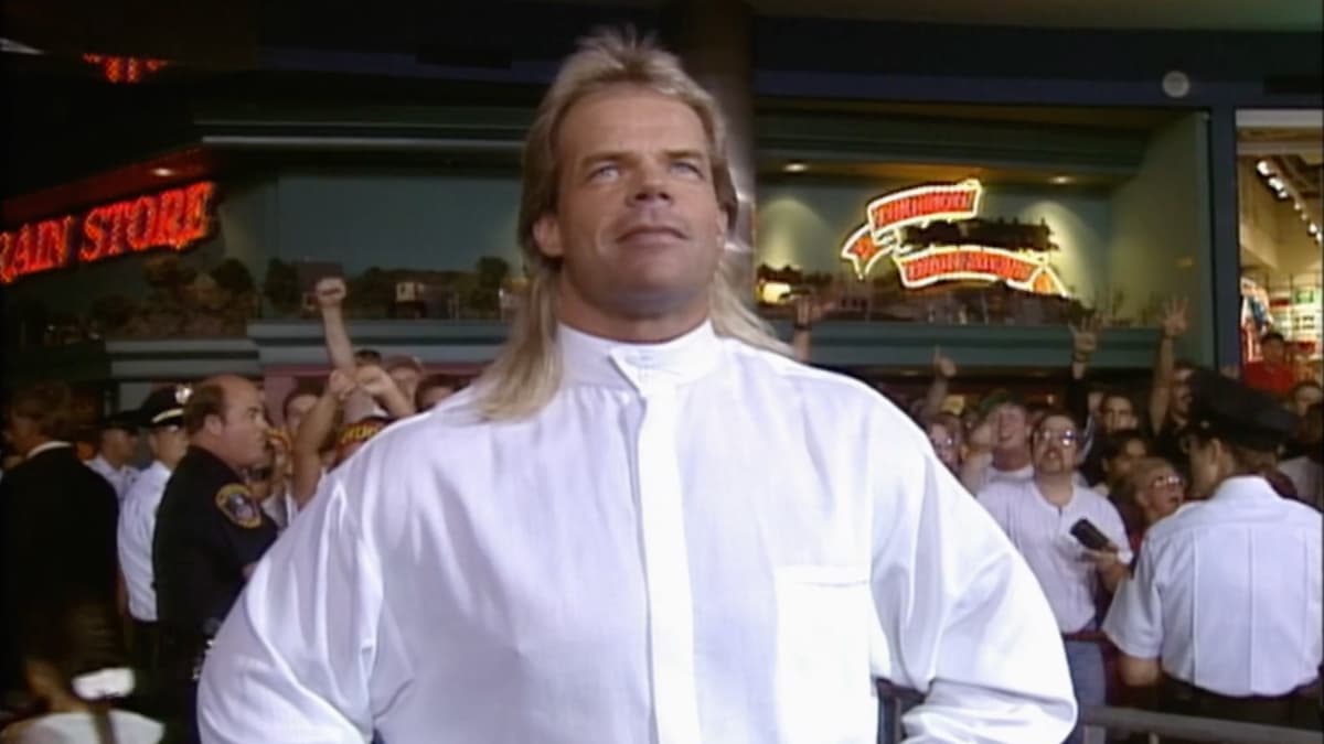 Lex Luger standing in a white shirt looking at the WCW Monday Nitro ring