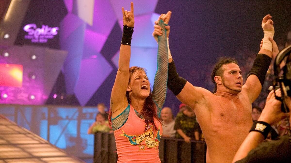 Lita having her arm raised by Matt Hardy