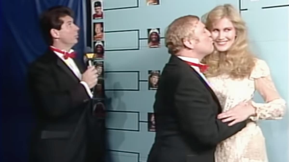 Lord Alfred Hayes kissing Susan Waitkus at WWF The Wrestling Classic