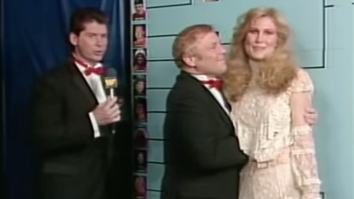 Lord Alfred Hayes gripping Susan Waitkus at WWF The Wrestling Classic