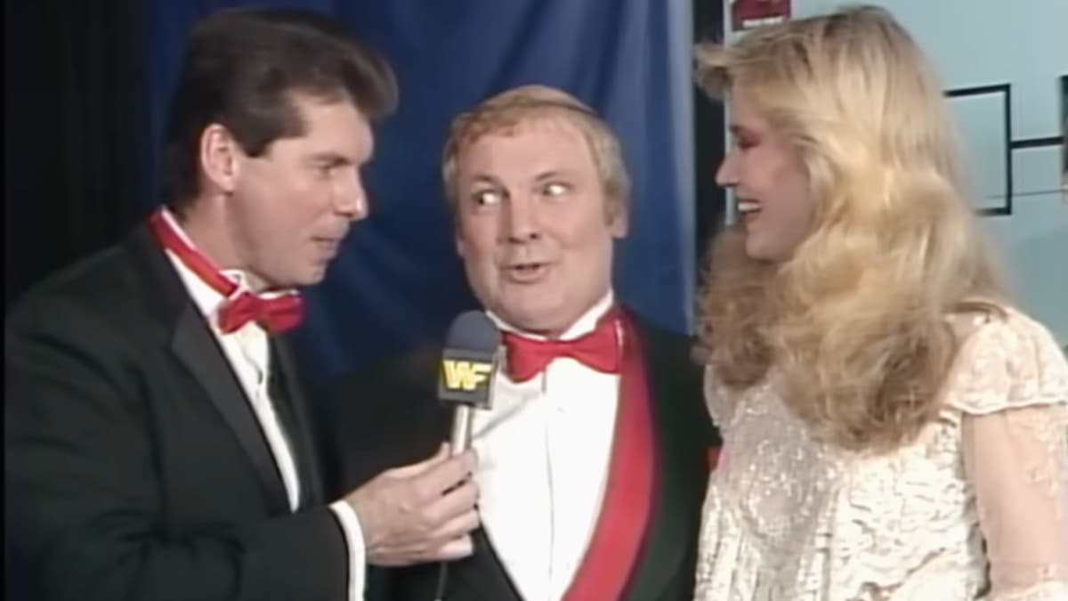 Lord Alfred Hayes with his eyes popping out at WWF The Wrestling Classic with Vince McMahon on the left and Susan Waitkus on the right