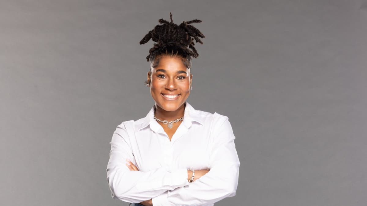 Masyn Holiday smiling in a white t-shirt during WWE photo shoot 