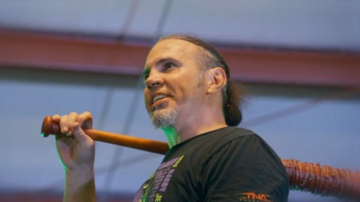 Matt Hardy smiles with a baseball bat over his shoulder