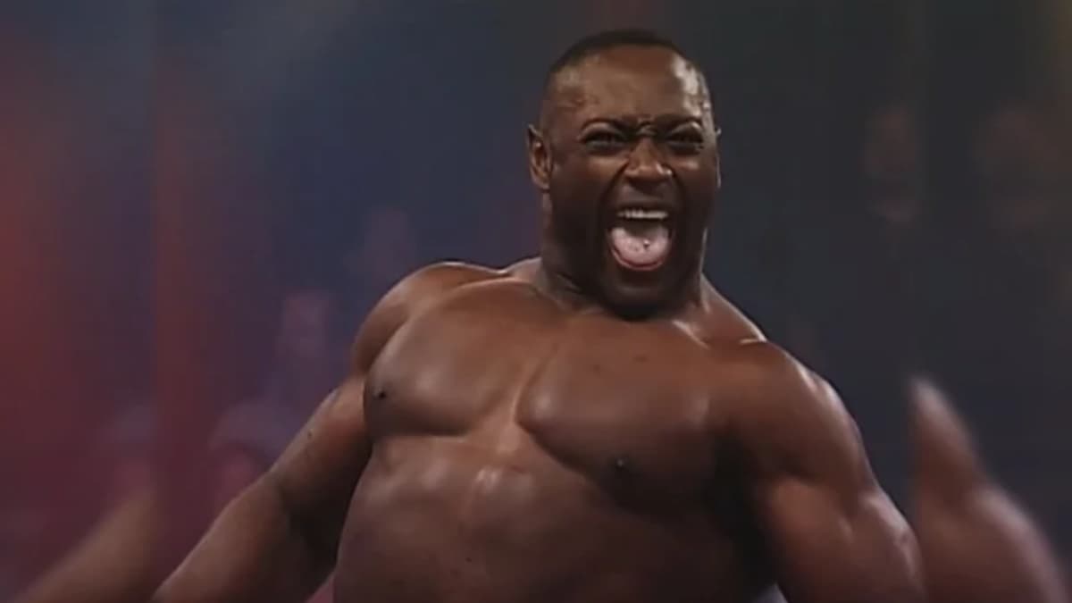 Monty Brown roaring in TNA in front of a blurred audience 