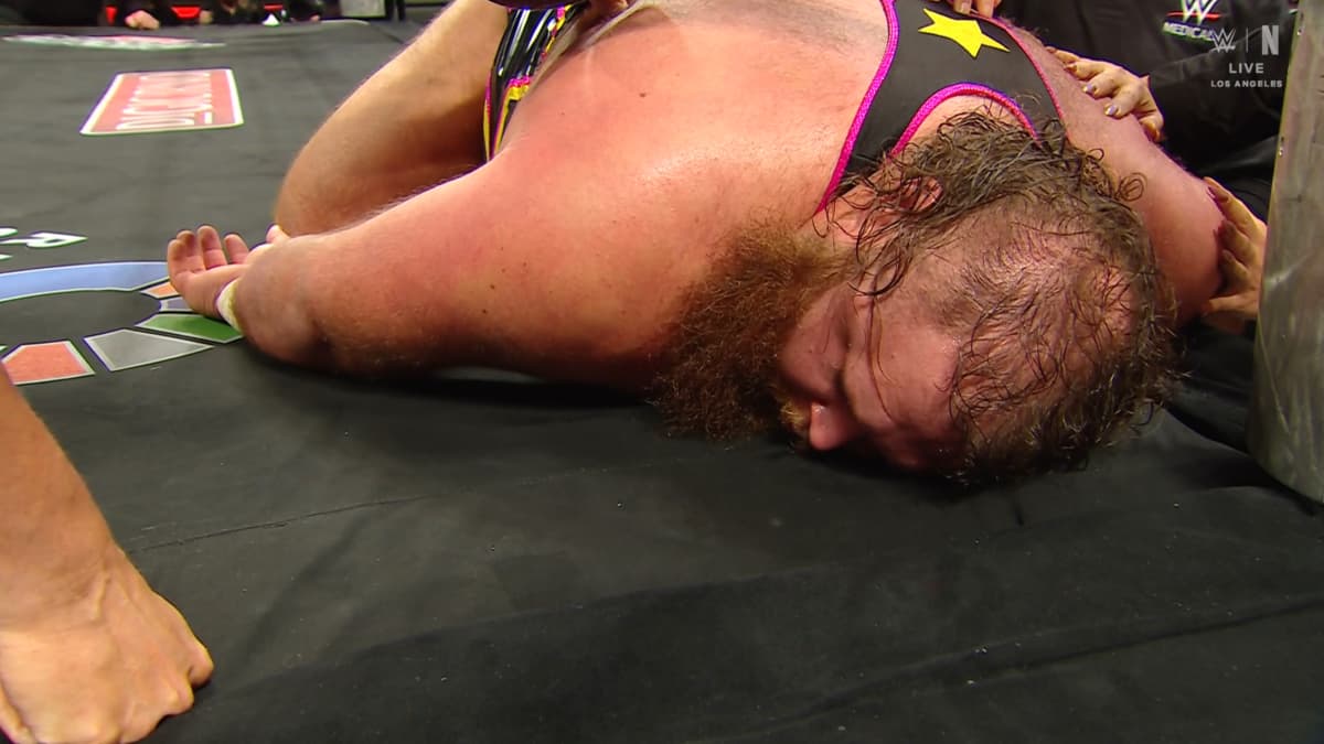 Otis lying on his stomach following WWE Raw injury angle