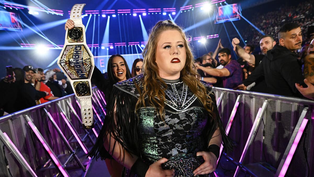 Piper Niven making her entrance with Chelsea Green holding up the WWE Women's United States Title behind her