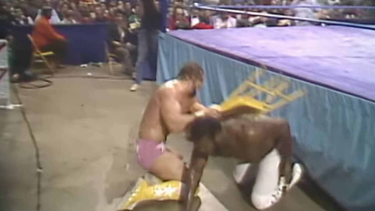 Randy Savage hitting Junkyard Dog at WWF The Wrestling Classic