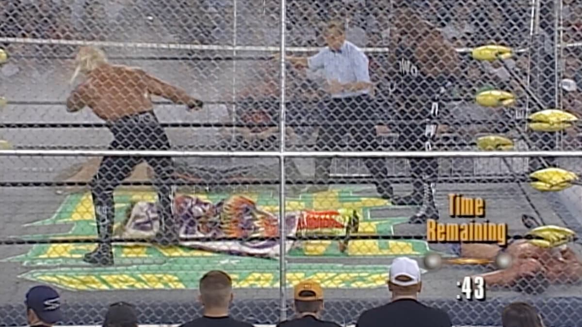 Hulk Hogan kicking The Renegade at WCW Fall Brawl 1998