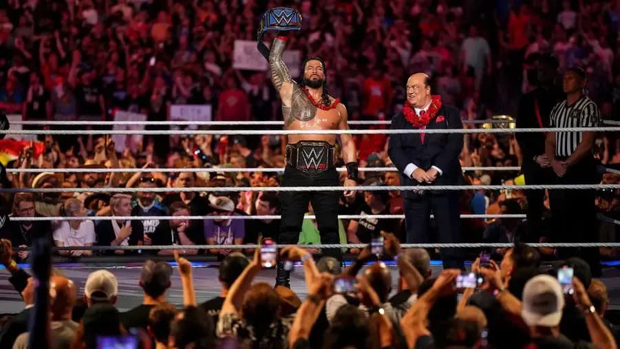 Roman Reigns SummerSlam 2022 all the belts.jpg