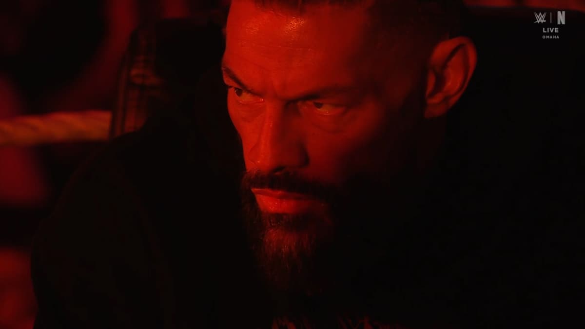 Roman Reigns bathed in red light on WWE Raw