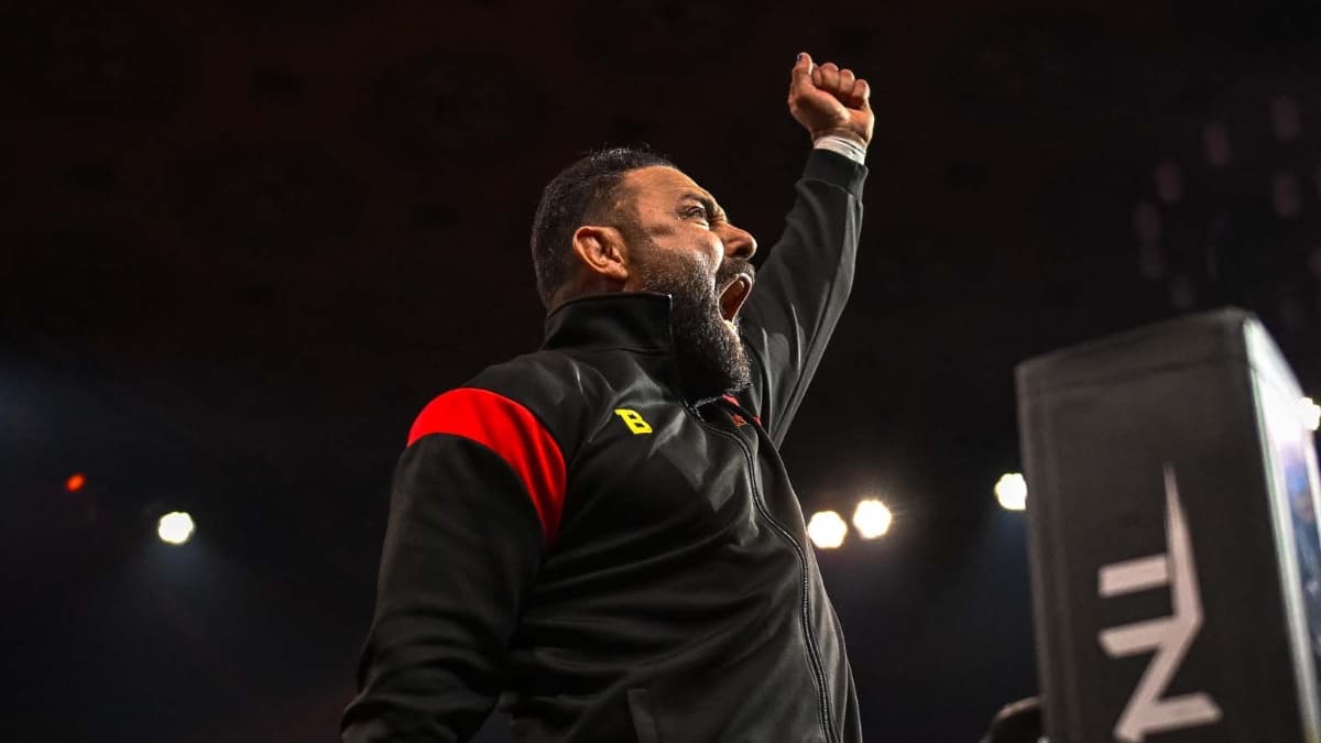 Santino Marella cheering with his arm in the air on TNA IMPACT