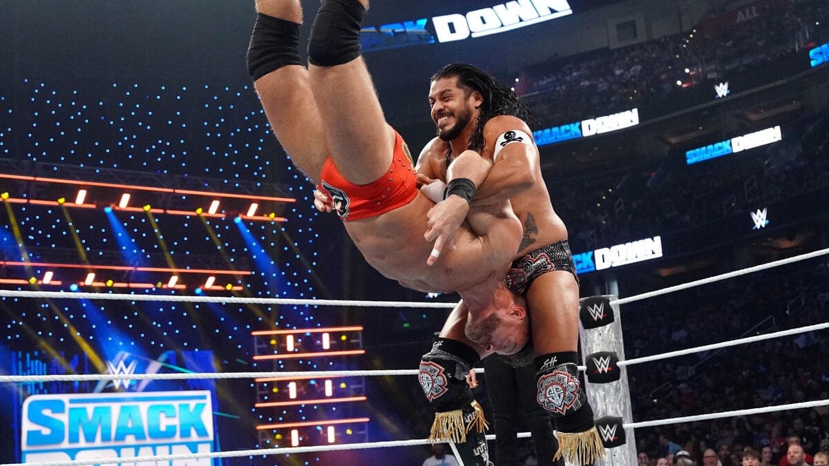 Santos Escobar holding LA Knight in the air on WWE SmackDown
