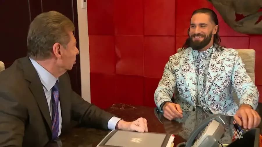 Seth Rollins Vince McMahon 2022.jpg
