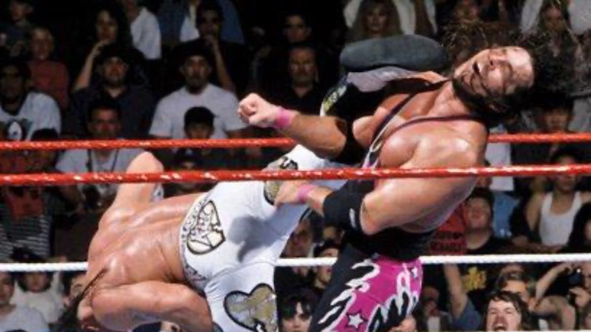 Shawn Michaels delivering Sweet Chin Music to Bret Hart at WrestleMania 12