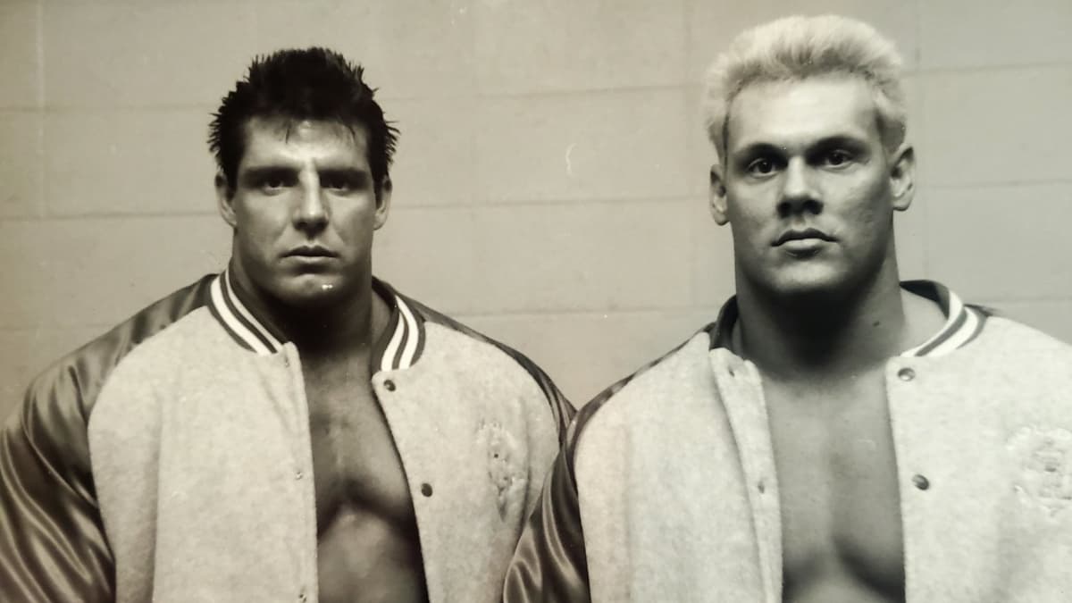 Sting and The Ultimate Warrior while they were the Blade Runners posing for a photo
