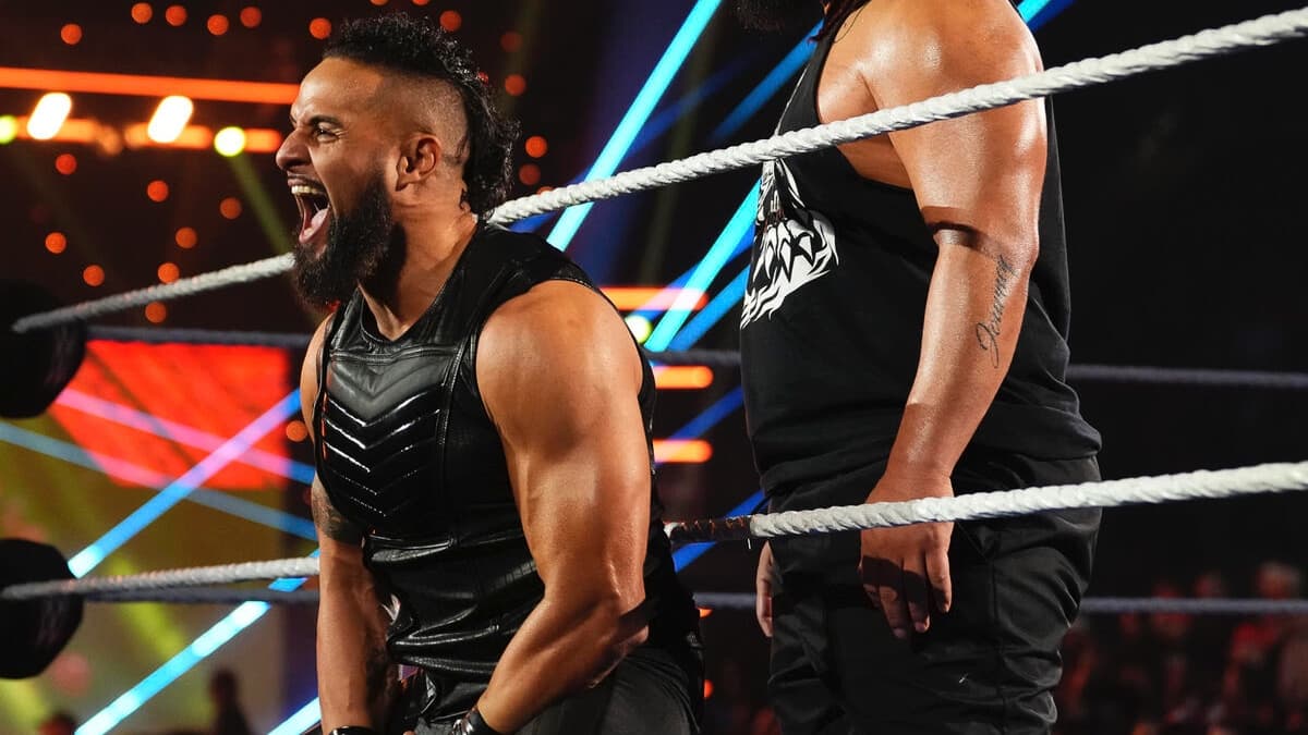 Tama Tonga laughing on the ring apron