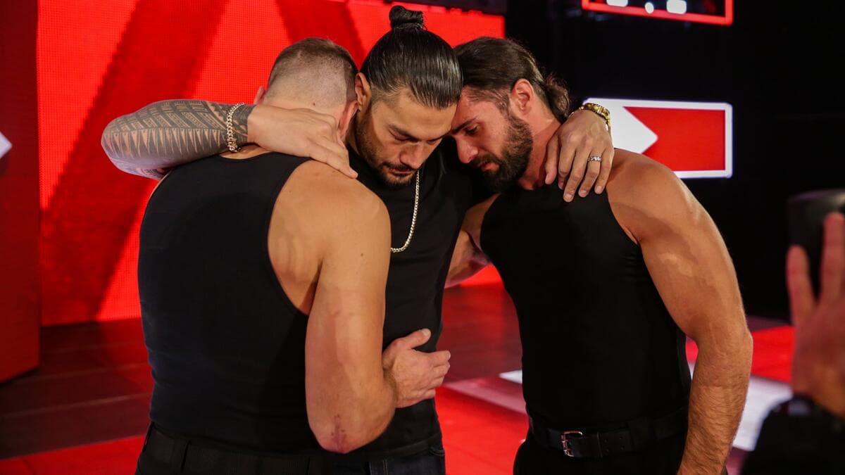 Roman Reigns hugging Dean Ambrose and Seth Rollins on WWE Raw