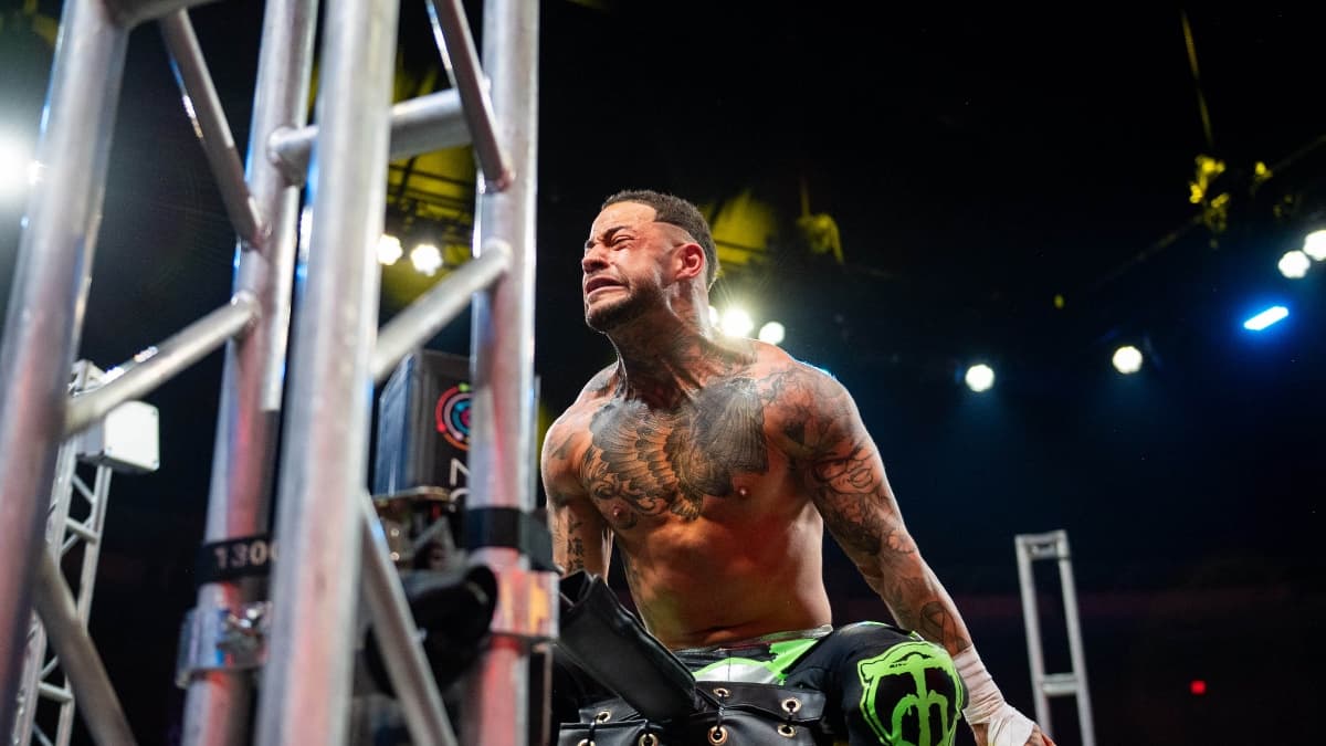 Trey Miguel clenching his neck in TNA return while standing on the top turnbuckle