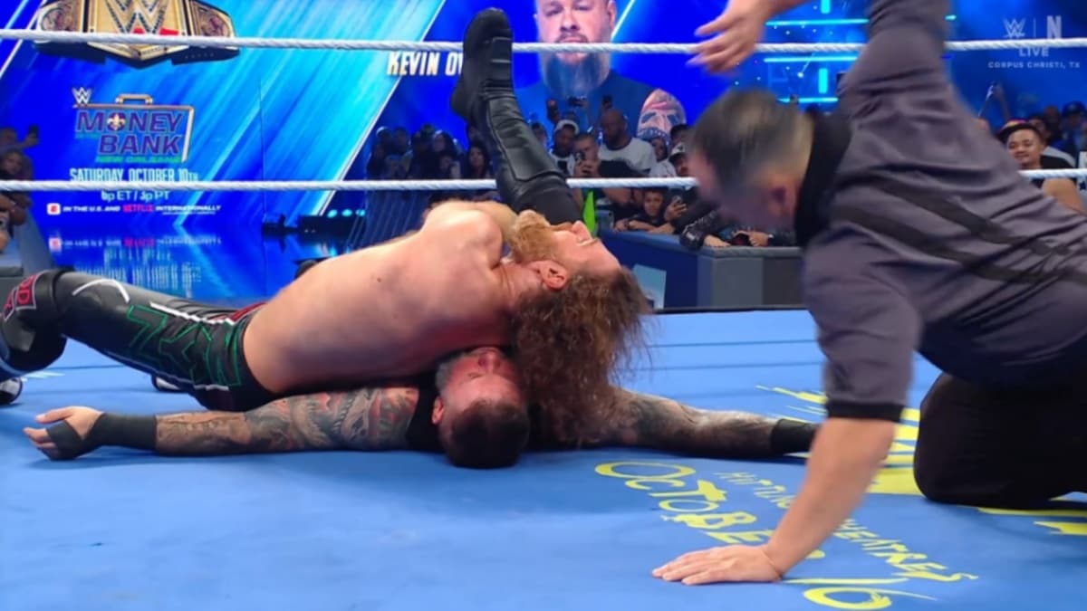 Sami Zayn pinning Kevin Owens