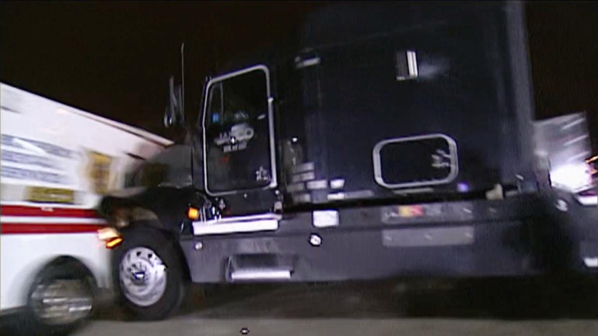 A semi-truck driven by Hollywood Hogan crashes into an ambulance containing The Rock on WWE Raw 