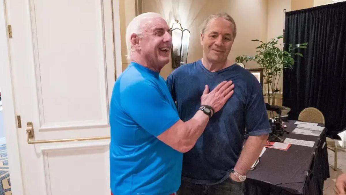 Ric Flair patting Bret Hart