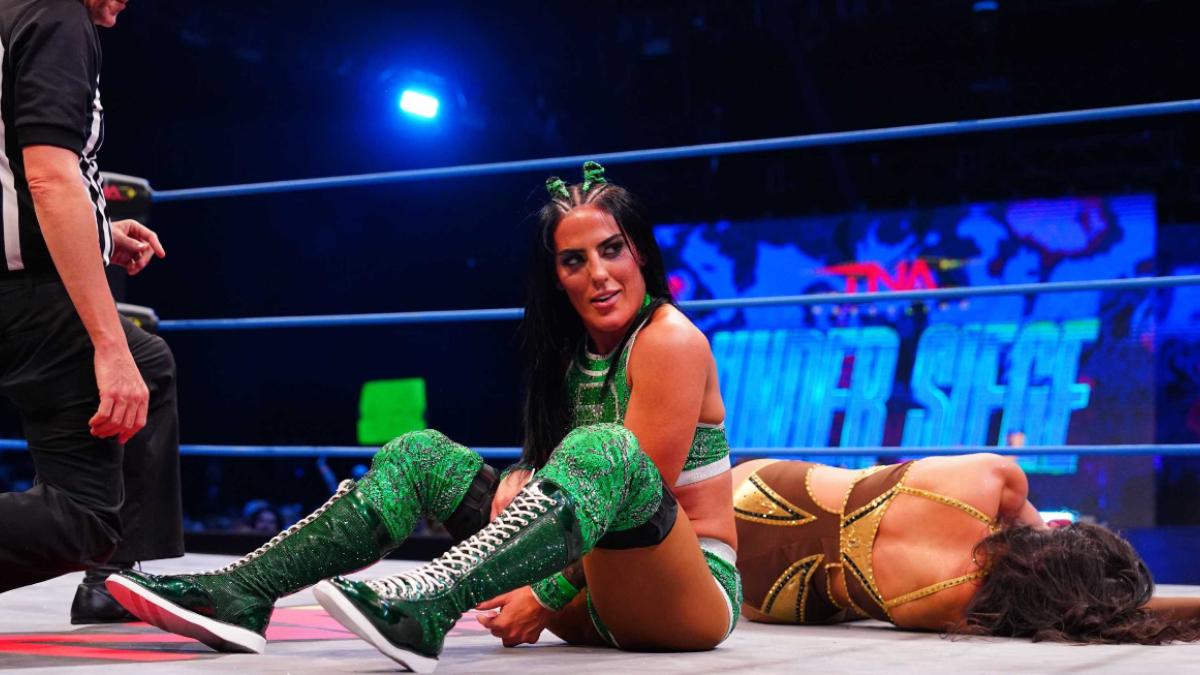 Tessa Blanchard in an all-green outfit at TNA Under Siege sitting in the ring