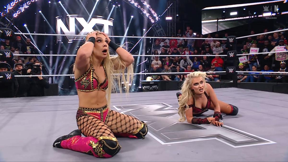 Thea Hail on her knees with her head in her hands as Blake Monroe lies next to her shocked