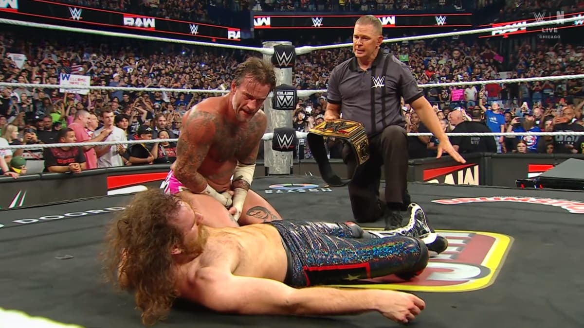 CM Punk looking at Sami Zayn after beating him for the WWE Title on Raw