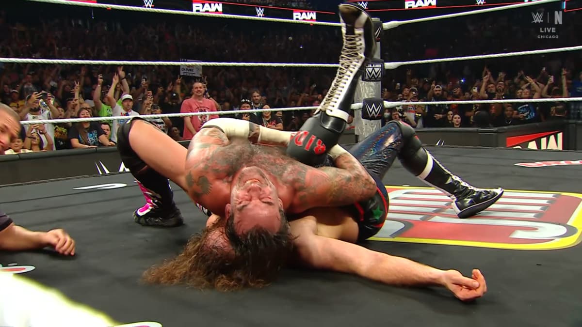 CM Punk pinning Sami Zayn to win the Undisputed WWE Title on Monday Night Raw