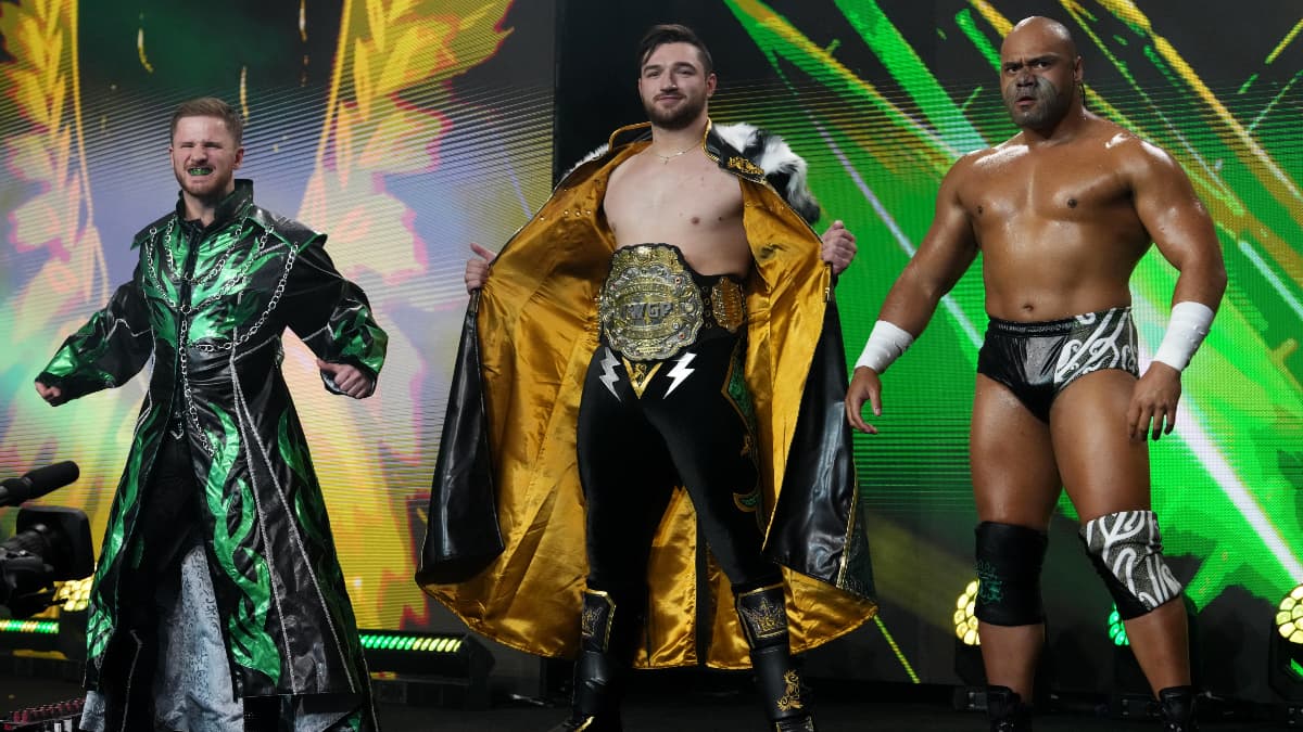 Callum Newman, HENARE, and Francesco Akira standing on the AEW Dynamite entrance ramp