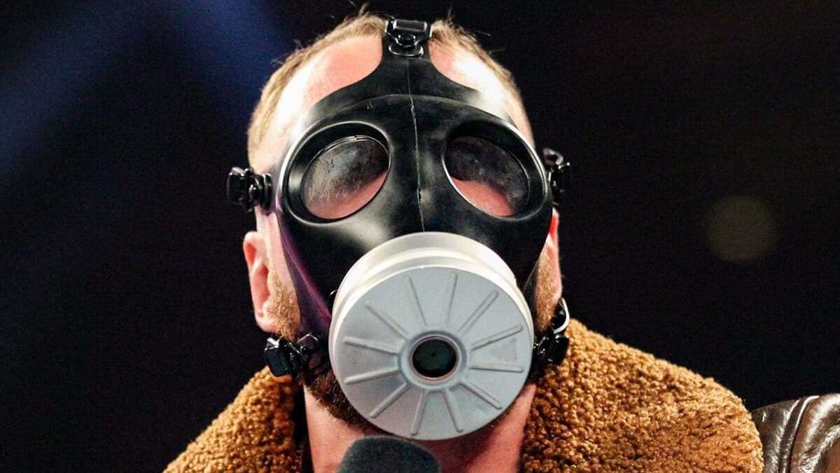 Dean Ambrose wearing a gas mask