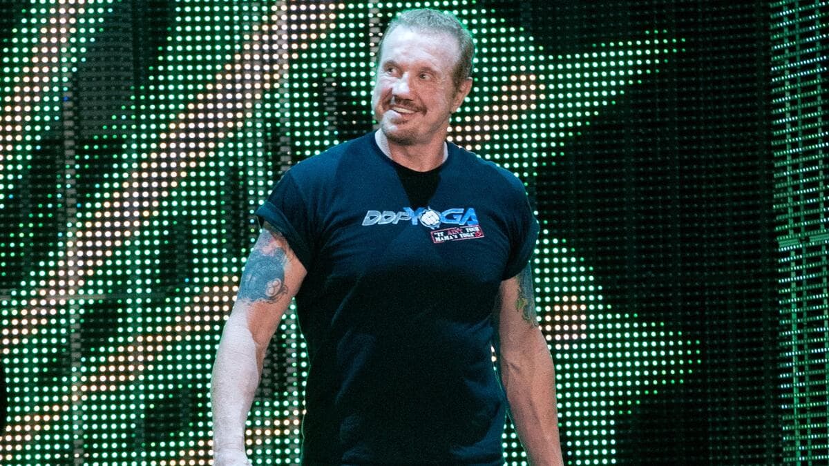 Diamond Dallas Page smiling in a DDP Yoga t-shirt