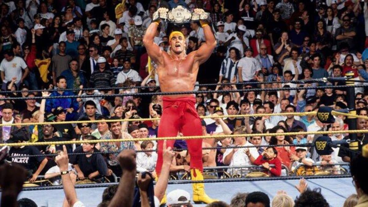 Hulk Hogan holding up the WWE Title at WrestleMania IX