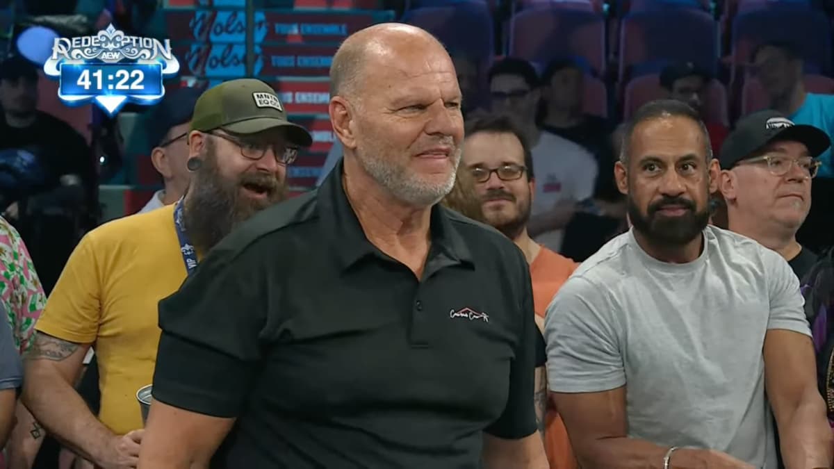 Jacques Rougeau at AEW Redemption standing outside of the ring