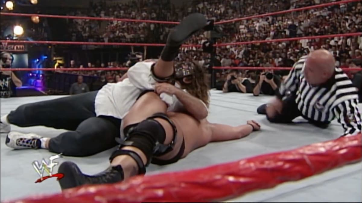 Mankind pinning Steve Austin as Jesse Ventura counts the pin at WWE SummerSlam 1999
