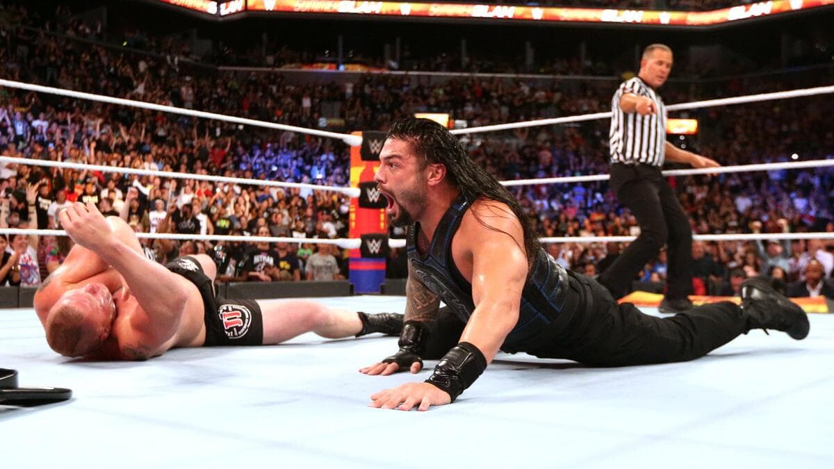 Roman Reigns screaming as Brock Lesnar lies down at WWE SummerSlam 2018
